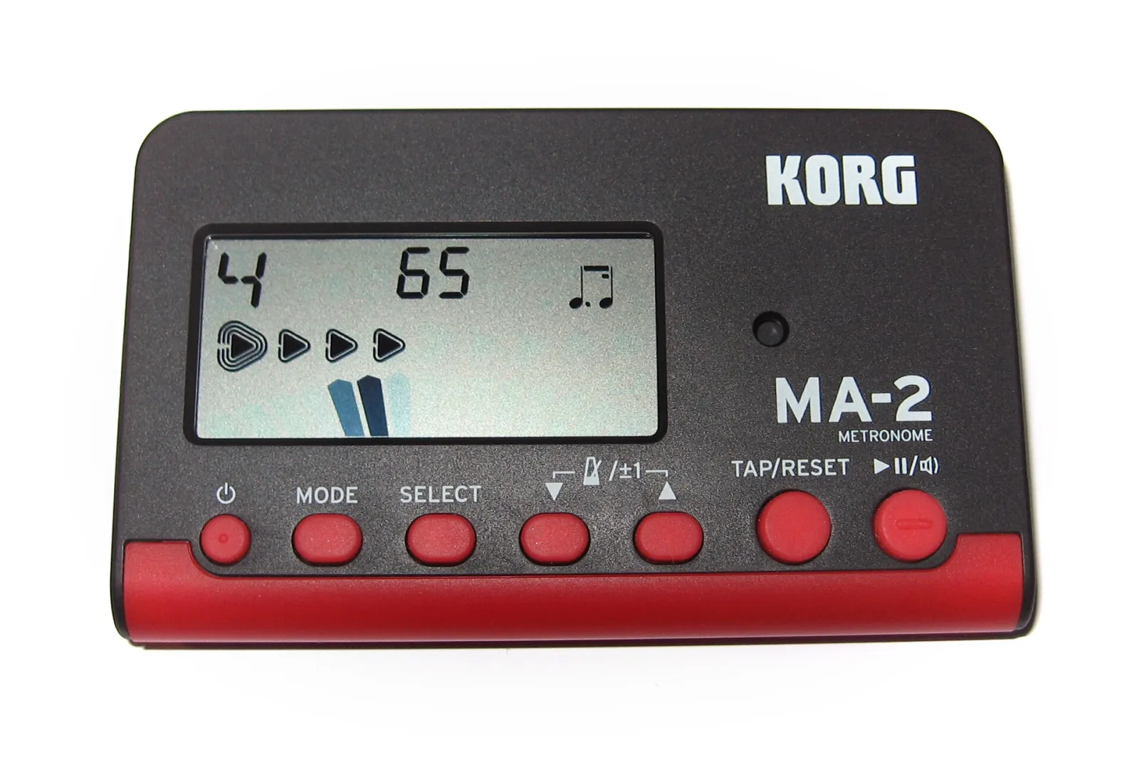 A red and black Korg MA-2 digital metronome showing 65 on its screen, with a tap button among its controls.